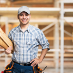 Portrait of a smiling carpenter in construction site